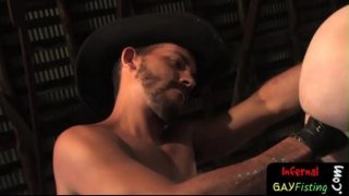 Smoldering Gay Cowboy Fists Lubed Up Ass