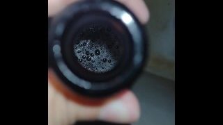 Dude Peeing On A Glass Bottle