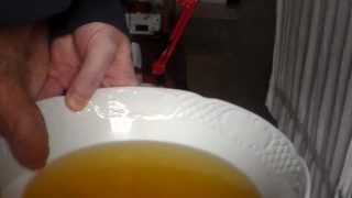 John Is Pissing In A Bowl In Closeup