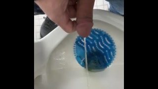 Pissing At A Urinal.