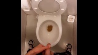 Young Guy Pissing In A Public Toilet