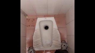 Young Guy Pissing In The Public Toilet