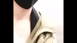 Korean boy in the bathroom of the mall